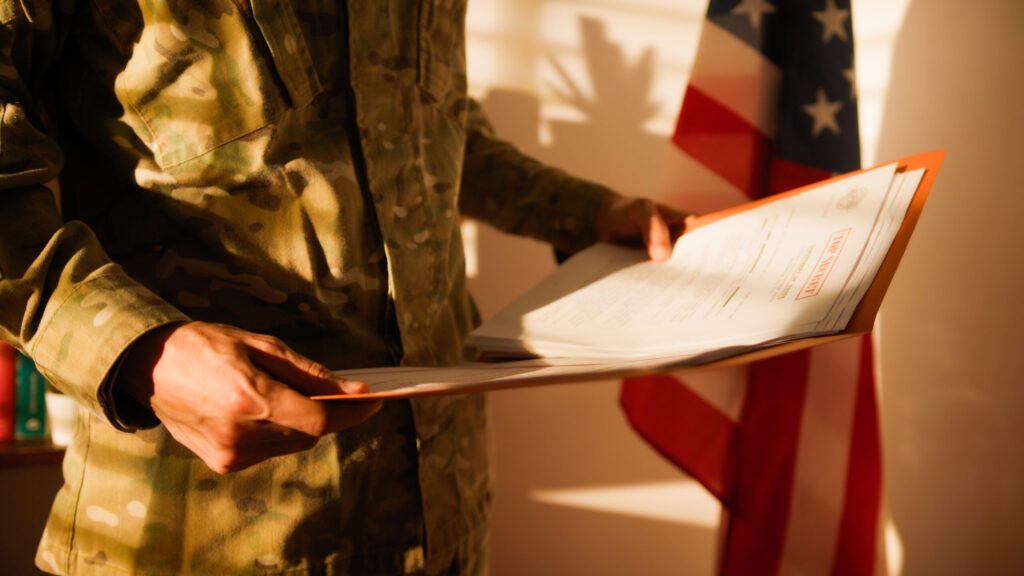 Soldier reads confidential documents in military office